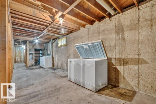 Concrete flooring, exposed ceiling joists, and concrete foundation walls - 12705 87 Street Nw, Edmonton, AB 