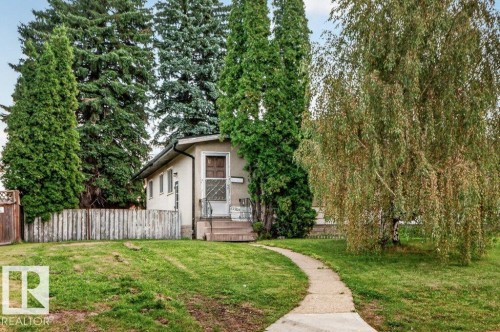 Mature trees, paved walkway, and a partial privacy fence - 12705 87 Street Nw, Edmonton, AB 