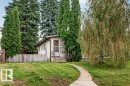 Mature trees, paved walkway, and a partial privacy fence - 12705 87 Street Nw, Edmonton, AB 