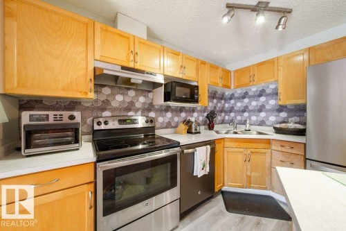 #118 2305 35A Av Nw, Edmonton, AB - Indoor Photo Showing Kitchen With Double Sink