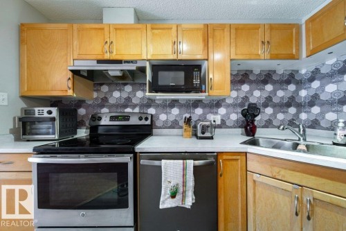 #118 2305 35A Av Nw, Edmonton, AB - Indoor Photo Showing Kitchen With Double Sink