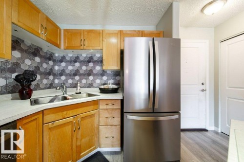 #118 2305 35A Av Nw, Edmonton, AB - Indoor Photo Showing Kitchen With Double Sink