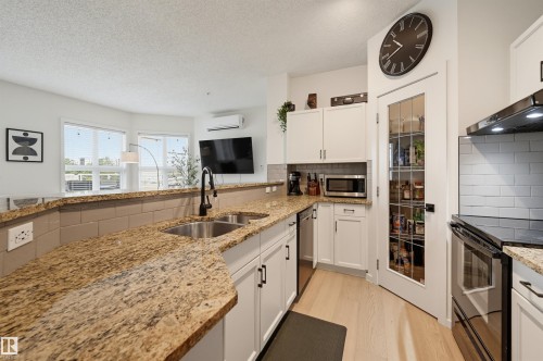 #403 9910 111 St Nw, Edmonton, AB - Indoor Photo Showing Kitchen With Double Sink