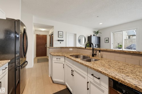 #403 9910 111 St Nw, Edmonton, AB - Indoor Photo Showing Kitchen With Double Sink