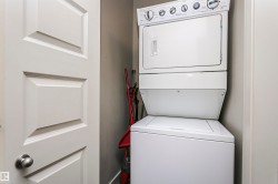 Stackable laundry appliances within a dedicated alcove - 