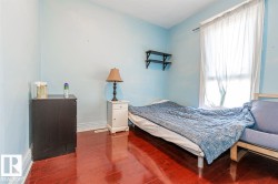 Wood-finish flooring with light blue walls - 