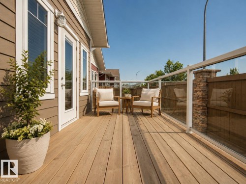 Expansive outdoor deck with wood-finish flooring - #9 175 Mcconachie Dr Nw, Edmonton, AB 
