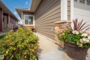 Horizontal siding with a stone veneer accent - #9 175 Mcconachie Dr Nw, Edmonton, AB 