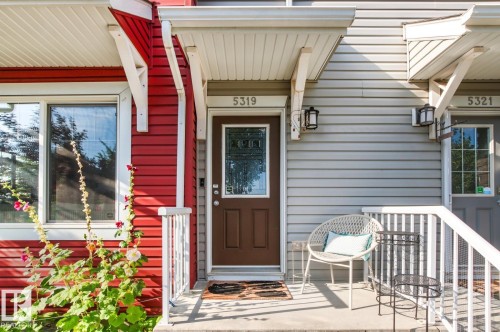 Siding exterior with contrasting red and gray panels - 5319 3 Avenue Sw, Edmonton, AB 