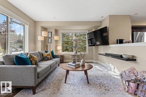 Recessed lighting, wood-finish flooring, and large windows - 5319 3 Avenue Sw, Edmonton, AB 
