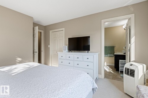 Soft neutral wall tones, white trim, and light carpeting define this space - 5319 3 Avenue Sw, Edmonton, AB 
