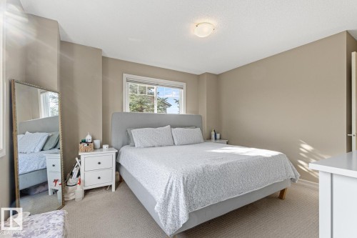 Window with exterior scenery, overhead flush-mount light fixture, and neutral-toned walls - 5319 3 Avenue Sw, Edmonton, AB 
