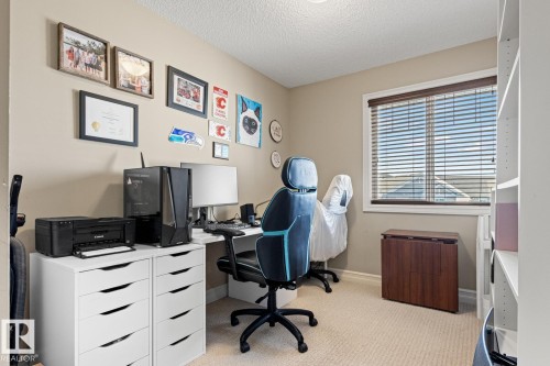 Neutral-toned walls complement the window with horizontal blinds - 5319 3 Avenue Sw, Edmonton, AB 