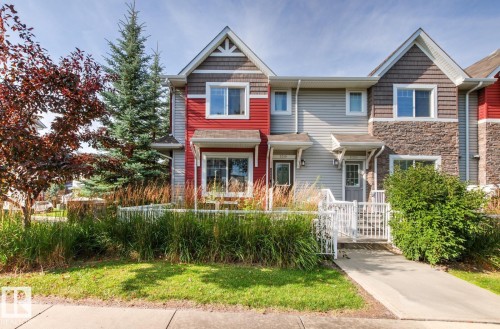 Two-story townhome with gabled roof lines and shake siding accents - 5319 3 Avenue Sw, Edmonton, AB 