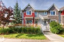 Two-story townhome with gabled roof lines and shake siding accents - 5319 3 Avenue Sw, Edmonton, AB 