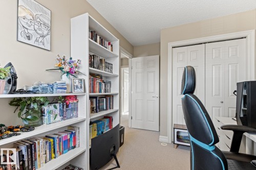 Built-in shelving, neutral wall paint, and paneled interior doors - 5319 3 Avenue Sw, Edmonton, AB 