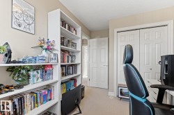 Built-in shelving, neutral wall paint, and paneled interior doors - 