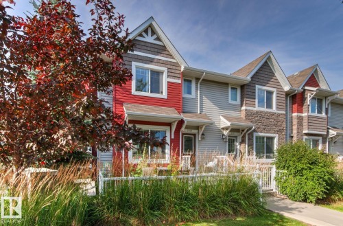 Multi-level exterior with mixed siding and stone accents - 5319 3 Avenue Sw, Edmonton, AB 