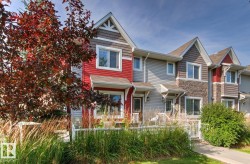 Multi-level exterior with mixed siding and stone accents - 
