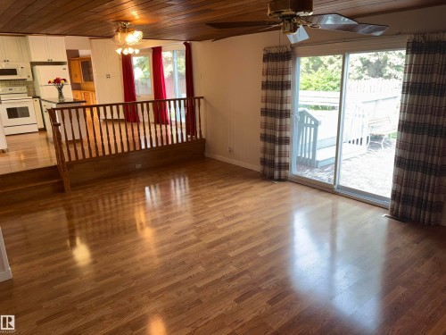 Wood-finish flooring throughout, with a wood panel ceiling - 4027 74 Street Nw, Edmonton, AB 