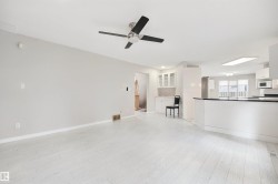 Light wood-finish flooring, recessed lighting, and a ceiling fan - 