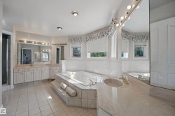 Tiled flooring and a built-in jetted tub - 