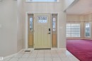 Entryway featuring a decorative front door with leaded glass, side lights, and a transom window - 5107 17 Avenue Nw, Edmonton, AB 