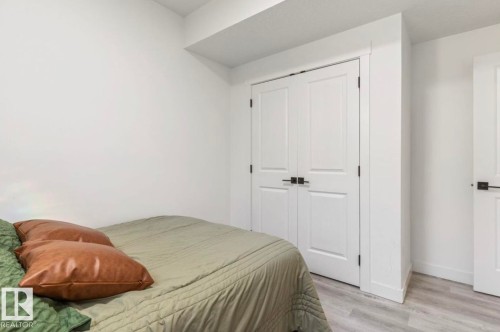 White walls, white trim, and light wood-finish flooring - 19703 29 Avenue Nw, Edmonton, AB 