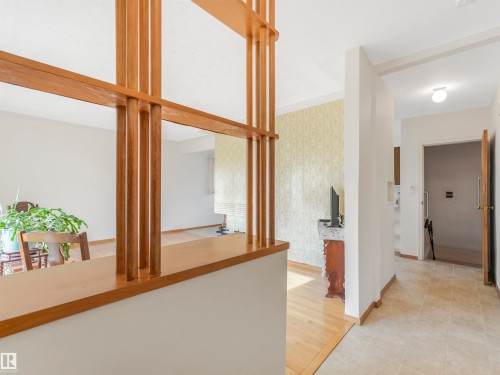 Decorative wood room divider with a half-wall base - 12614 69 Street Nw, Edmonton, AB 