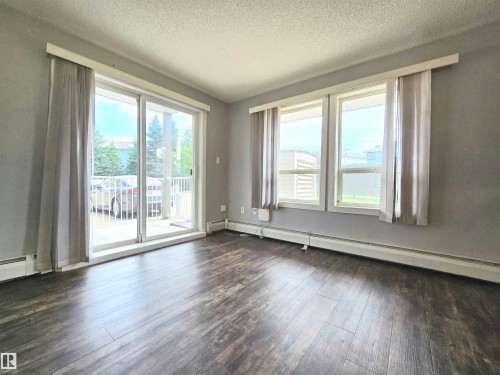 Spacious room with plenty of natural light and additional windows, as it is a corner unit. - #105 155 Edwards Dr Sw, Edmonton, AB - Indoor Photo Showing Other Room