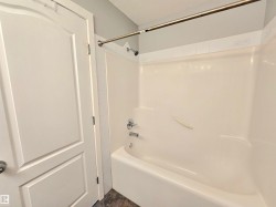 Tub and shower combination with chrome fixtures - 