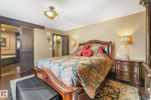 Wood-finish flooring with a ceiling-mounted light fixture - 12827 150 Avenue Nw, Edmonton, AB 