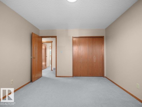 Third Bedroom - Neutral-toned walls complement light gray carpeting - 535 Pardee Bay Nw, Edmonton, AB 