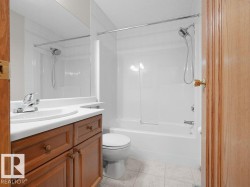 BAthroom located on the upper level. 4 pce. guest bathroom. Wood-finish vanity with white countertop, integrated sink, and chrome faucet - 
