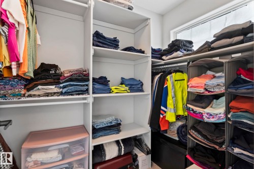 Custom closet organization system with ample shelving and hanging rods - 10338 162St Nw, Edmonton, AB 