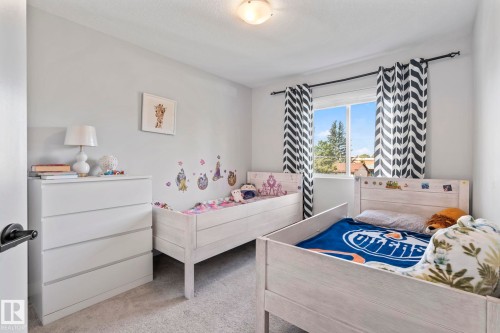 Recessed lighting and a window with a curtain rod - 10338 162St Nw, Edmonton, AB 