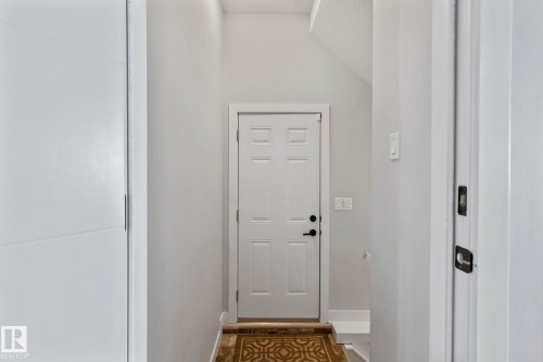 White paneled door with black hardware - 10338 162St Nw, Edmonton, AB 