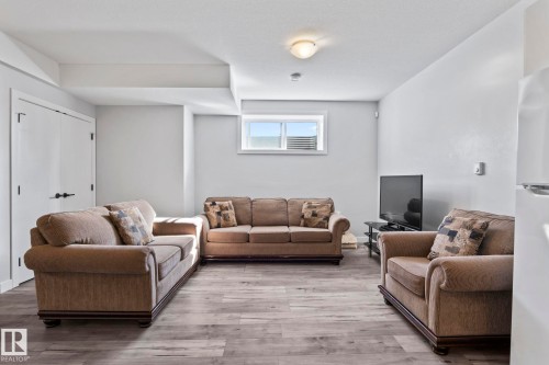 Recessed window, wood-finish flooring, white double doors, flush-mount ceiling light - 10338 162St Nw, Edmonton, AB 