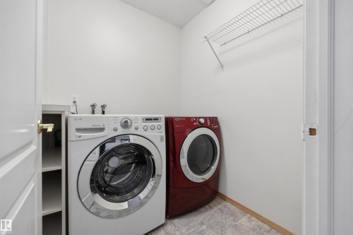 Laundry room and appliances on the second floor - 6910 158A Avenue Nw, Edmonton, AB 