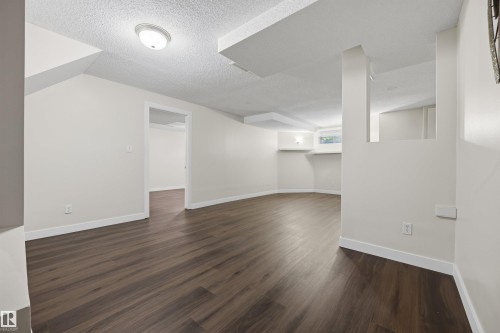 Large fully finished basement recreation room - 6910 158A Avenue Nw, Edmonton, AB 