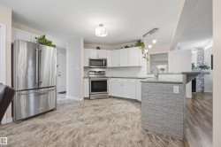 View of open-concept kitchen with updated appliances - 