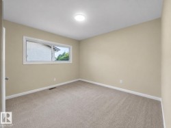 Neutral-toned walls complement the light-colored carpeting - 