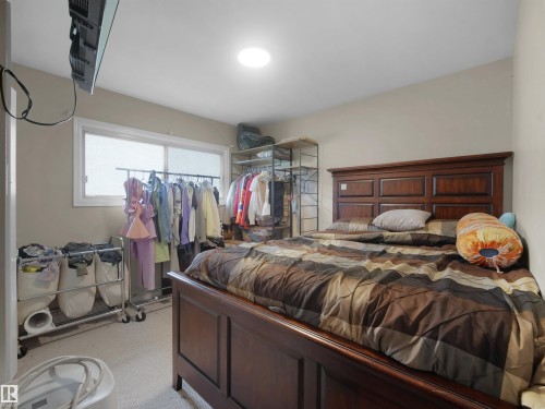 Recessed ceiling lighting and a large window provide illumination - 12002 48 Street Nw, Edmonton, AB 