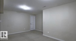 Neutral-toned walls with carpeted flooring - 