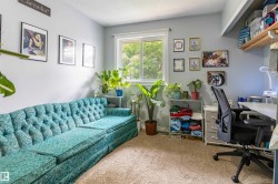 Carpeted room with light grey walls and a white-framed window - 