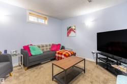 Carpeted room featuring a ceiling vent, recessed window, and light blue walls - 
