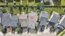 Gabled roofline, attached garage, paved driveway, landscaped front yard, and fenced backyard - 22933 94A Avenue Nw, Edmonton, AB 