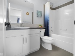 Vanity with a rectangular undermount sink, gray countertop, and brushed nickel faucet - 