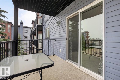Private balcony with durable black metal railings and a textured concrete floor - #316 392 Silver Berry Rd Nw, Edmonton, AB - Outdoor With Exterior