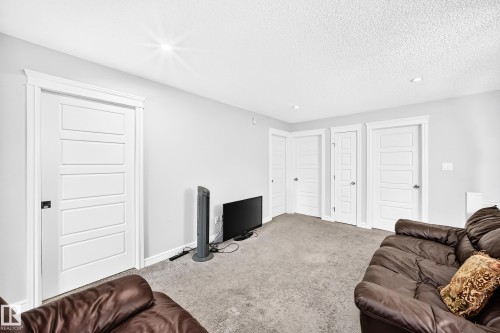 Wall-to-wall carpeting and recessed lighting - 2628 Donaghey Crescent Sw, Edmonton, AB 